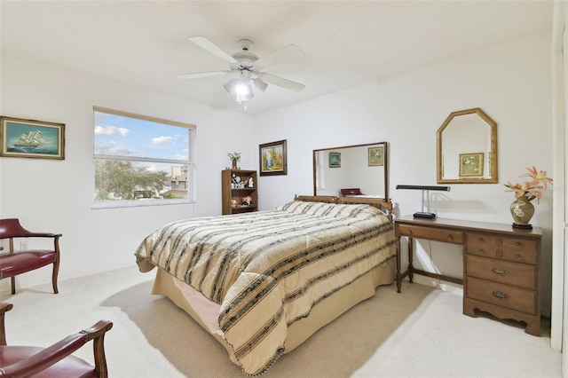 bedroom with light colored carpet and ceiling fan