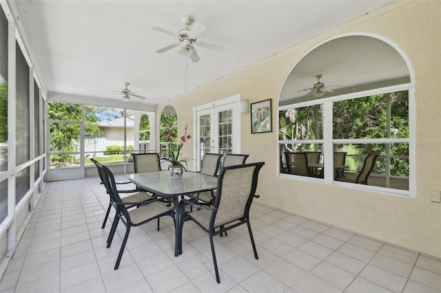 sunroom / solarium with french doors and ceiling fan