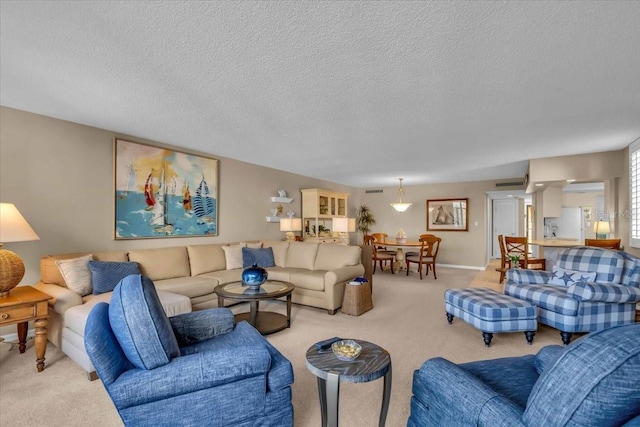 carpeted living room featuring a textured ceiling