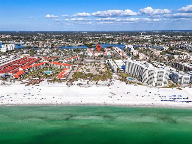 drone / aerial view with a water view and a beach view