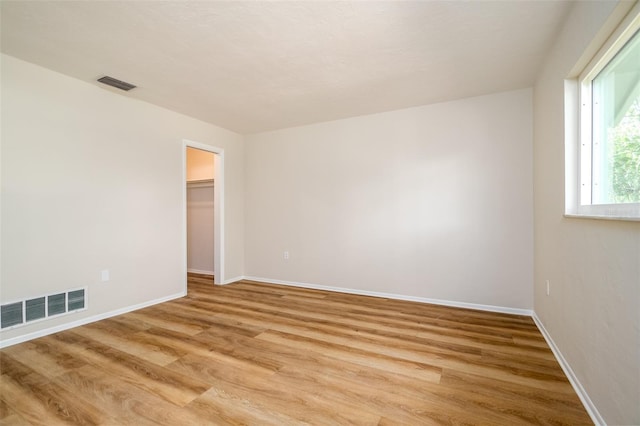 unfurnished room featuring light hardwood / wood-style flooring