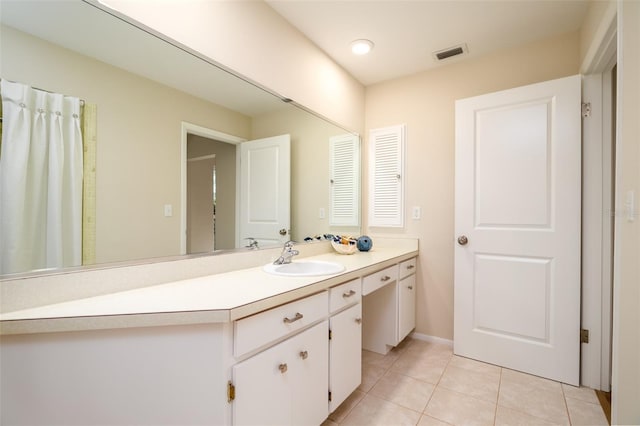 bathroom with vanity and tile patterned floors