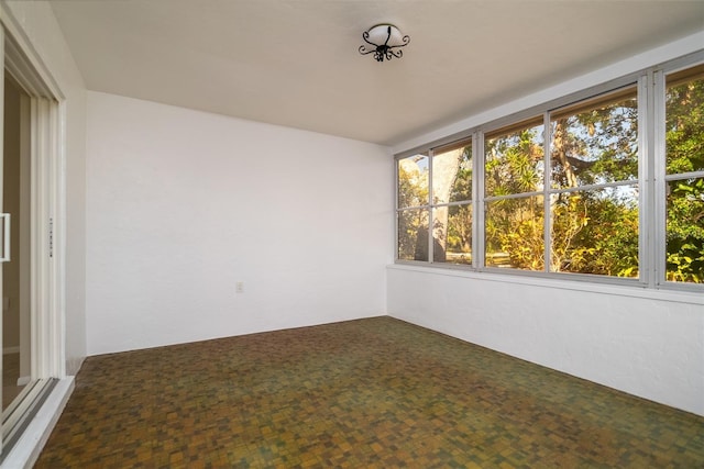 unfurnished sunroom with plenty of natural light