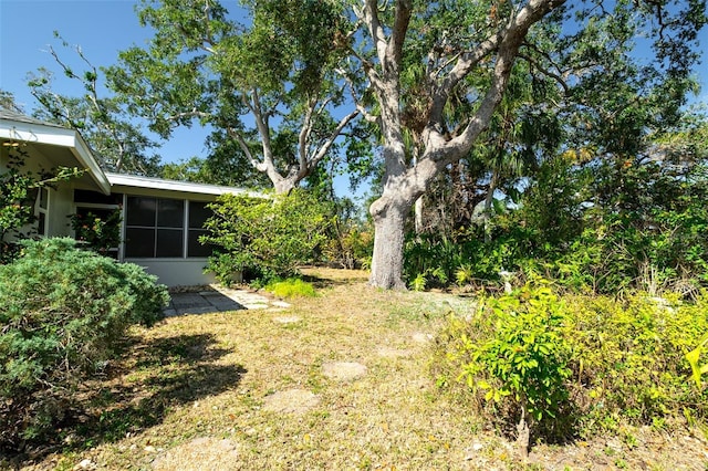 view of yard featuring a sunroom