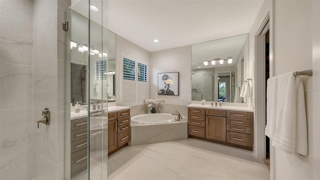 bathroom featuring plus walk in shower and vanity