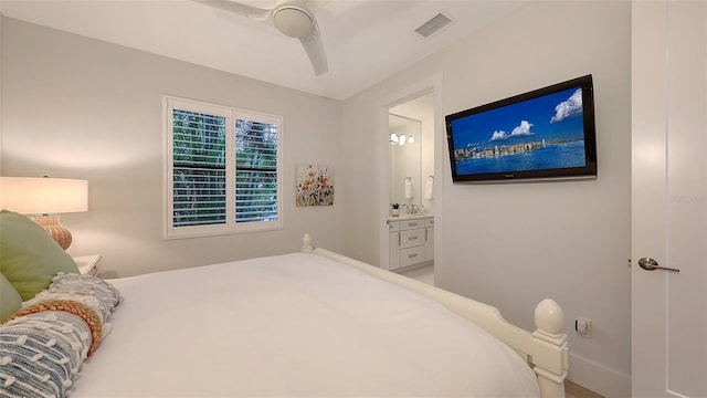 bedroom with ensuite bathroom and ceiling fan