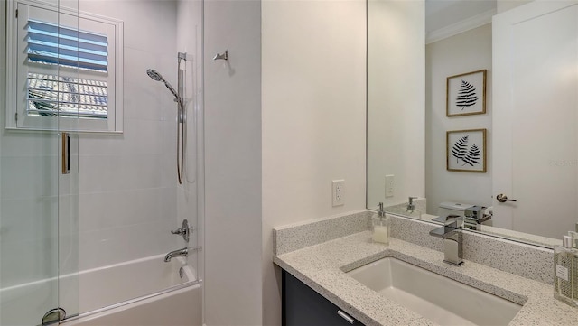 bathroom with crown molding, vanity, and bathtub / shower combination