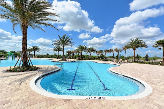 view of swimming pool with a patio area