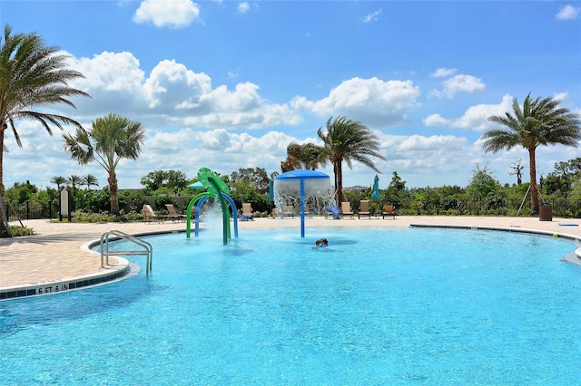 view of pool featuring pool water feature