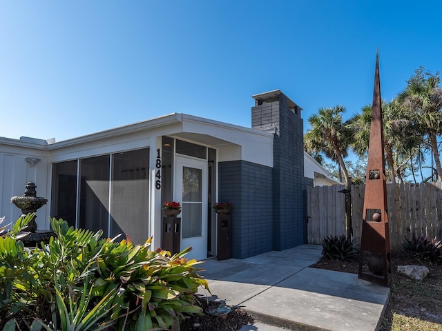 exterior space featuring a sunroom