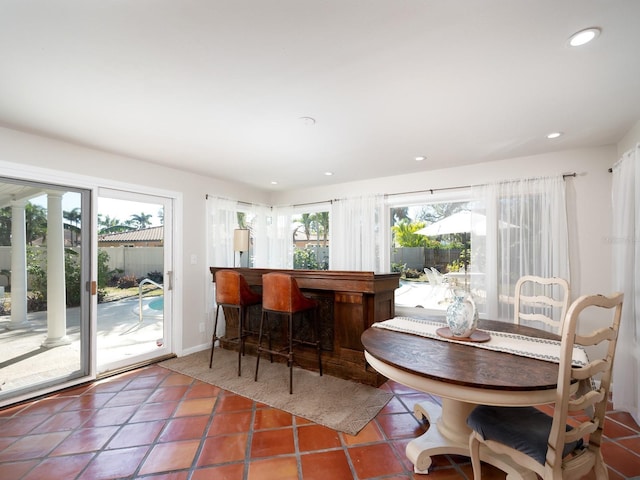 tiled dining space with bar area