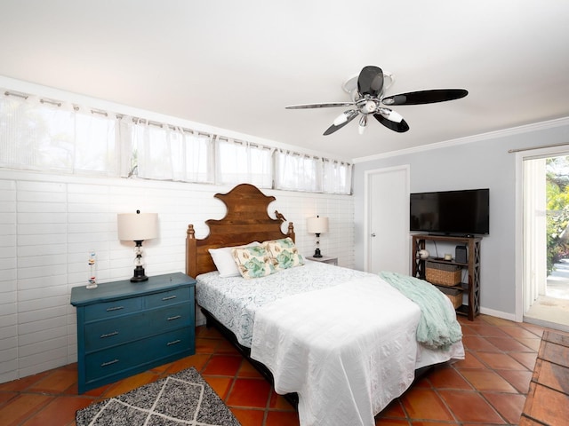 tiled bedroom with ceiling fan and ornamental molding