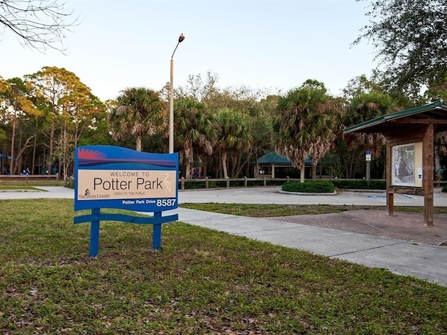 view of home's community with a yard