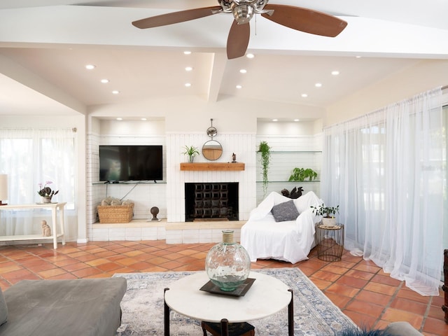 tiled living room featuring vaulted ceiling with beams