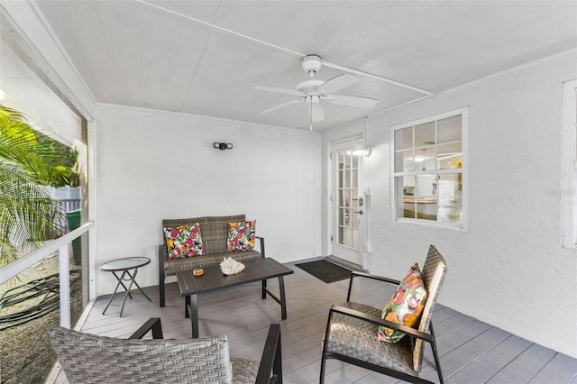 interior space with ceiling fan