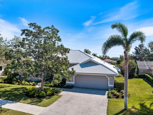 view of front of house with a garage and a front yard