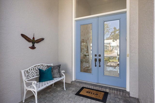 property entrance featuring french doors