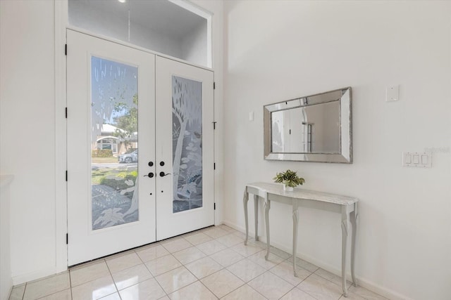 entrance foyer with french doors and light tile patterned floors