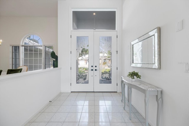 doorway featuring french doors and light tile patterned floors