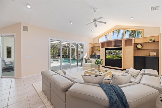 living room featuring light tile patterned floors, high vaulted ceiling, and ceiling fan