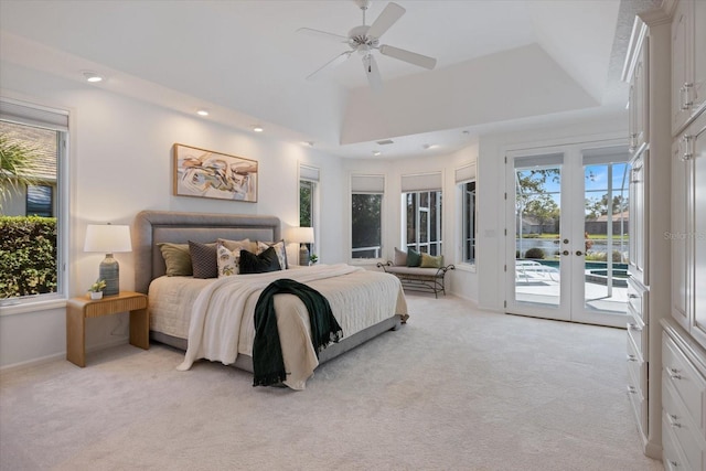 bedroom with french doors, light colored carpet, ceiling fan, and access to outside