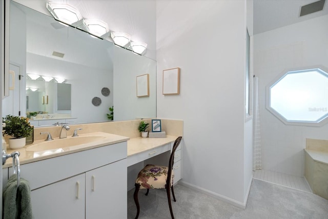 bathroom featuring vanity and a tile shower