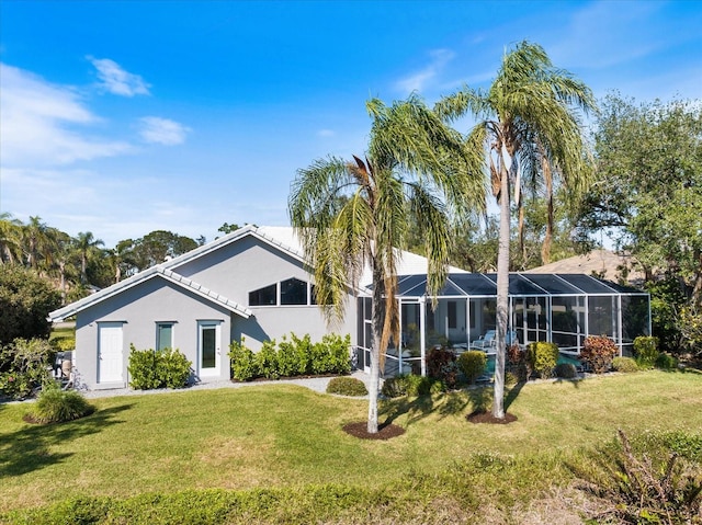 view of front facade with a lanai and a front yard