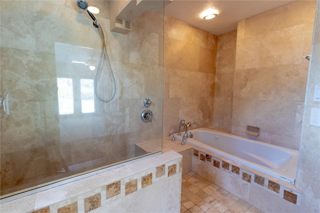 bathroom with tiled shower and a garden tub