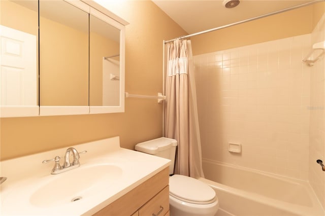 bathroom featuring vanity, toilet, and shower / tub combo with curtain