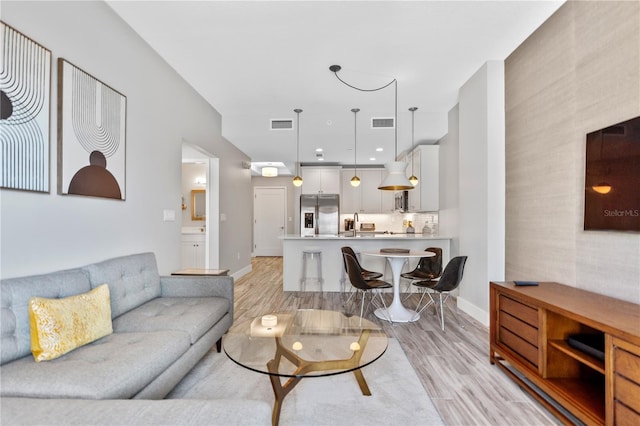 living room with light hardwood / wood-style floors