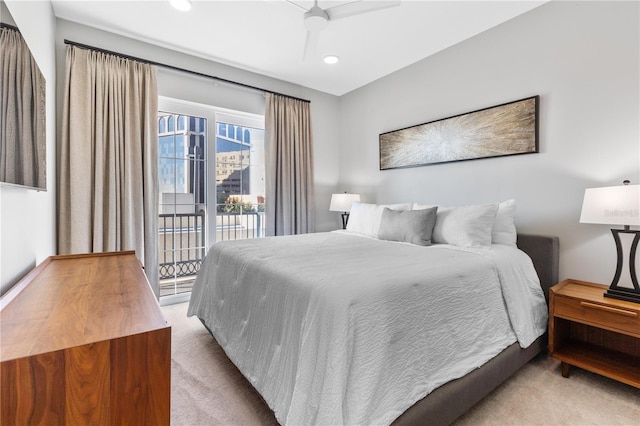 carpeted bedroom featuring access to outside and ceiling fan