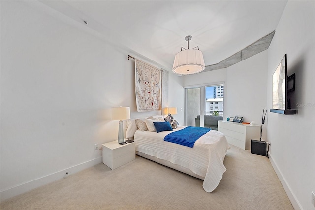 bedroom featuring light carpet