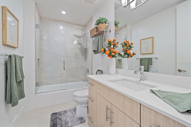 full bathroom with vanity, tile patterned floors, shower / bath combination with glass door, and toilet