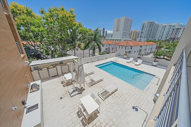 view of pool featuring a patio