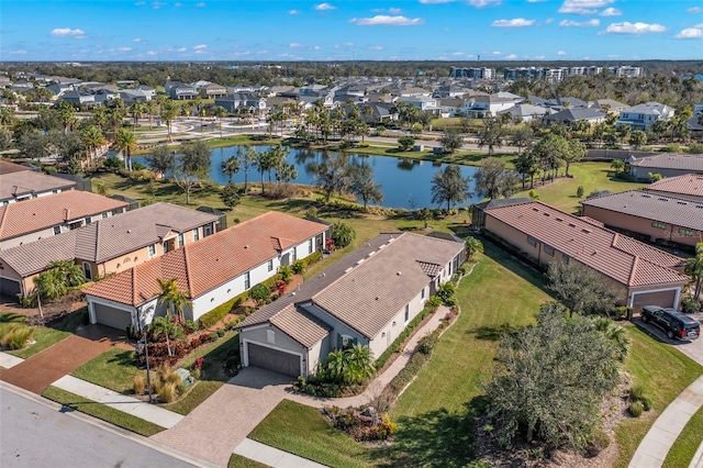 bird's eye view with a water view and a residential view