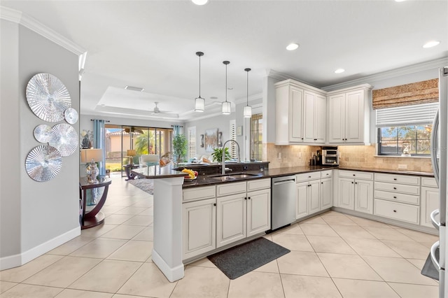 kitchen with ornamental molding, backsplash, a peninsula, a sink, and stainless steel dishwasher