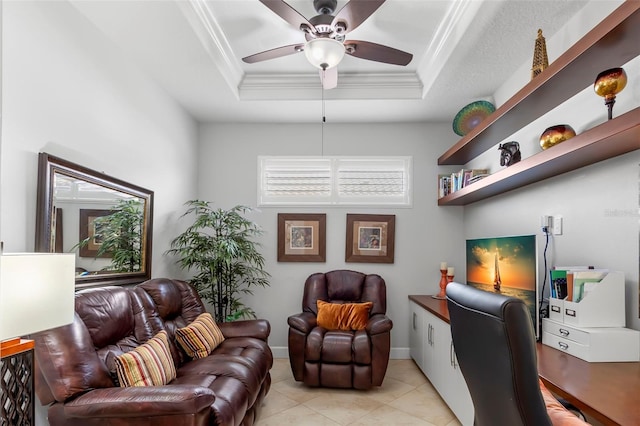 home office featuring baseboards, ceiling fan, ornamental molding, a tray ceiling, and light tile patterned flooring