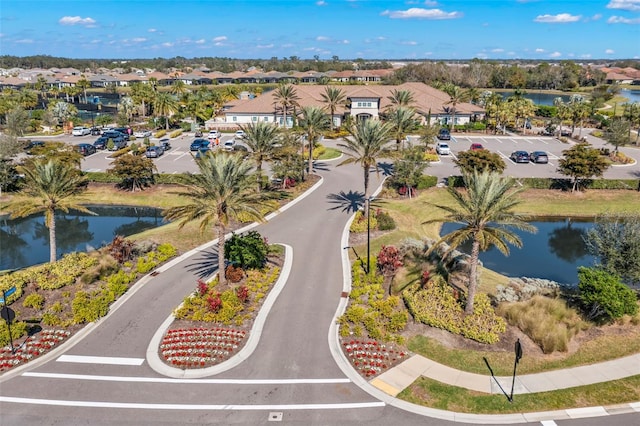 aerial view with a water view and a residential view