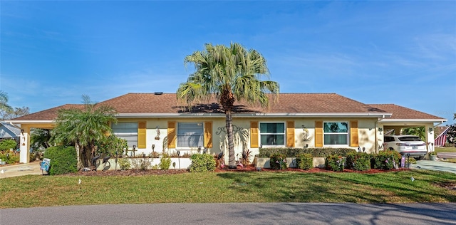 ranch-style house with a front lawn and a carport