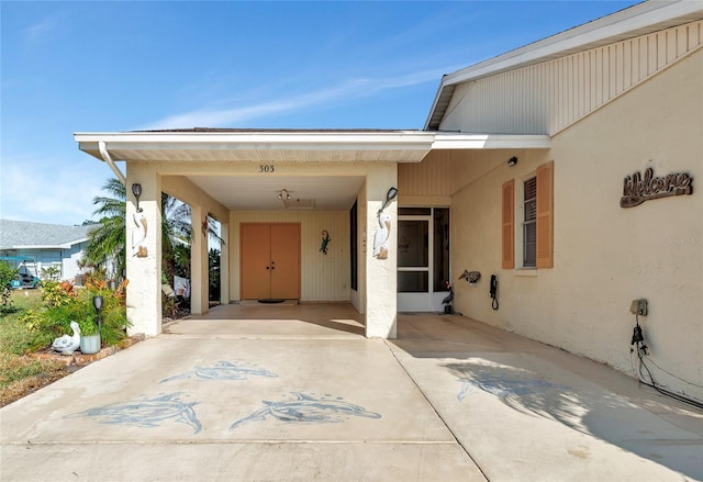 view of patio / terrace with a carport