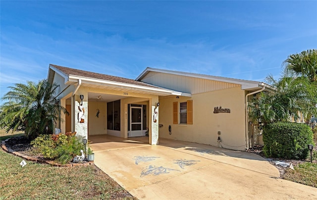 rear view of house featuring a carport