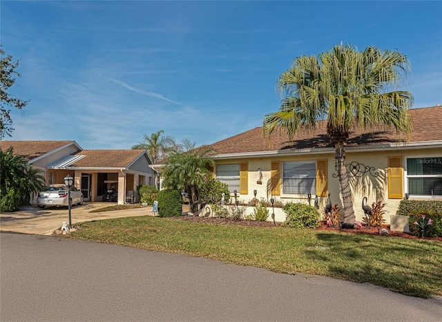 single story home with a front yard