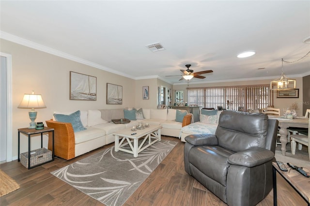 living room featuring crown molding, ceiling fan, and dark hardwood / wood-style flooring