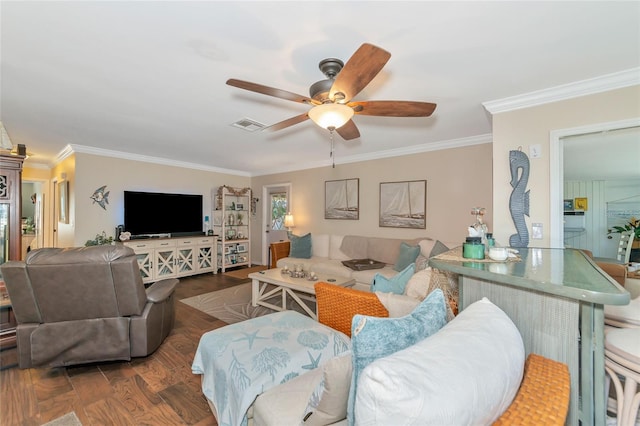 living room with crown molding, ceiling fan, and dark hardwood / wood-style floors