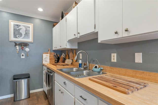 kitchen featuring sink, crown molding, dishwasher, and white cabinets