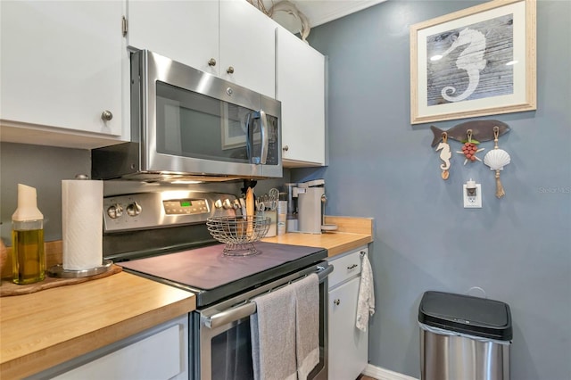 kitchen with stainless steel appliances and white cabinets