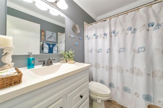 bathroom with vanity, ornamental molding, and toilet