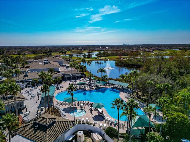 view of swimming pool featuring a water view