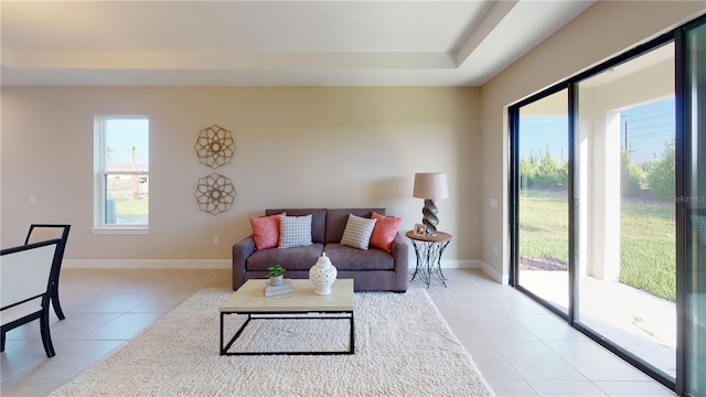 living room featuring light tile patterned flooring and plenty of natural light