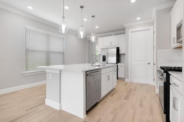26930 Lark Ct, Punta Gorda, FL 33955 - kitchen with appliances with stainless steel finishes, a sink, decorative backsplash, light countertops, and recessed lighting